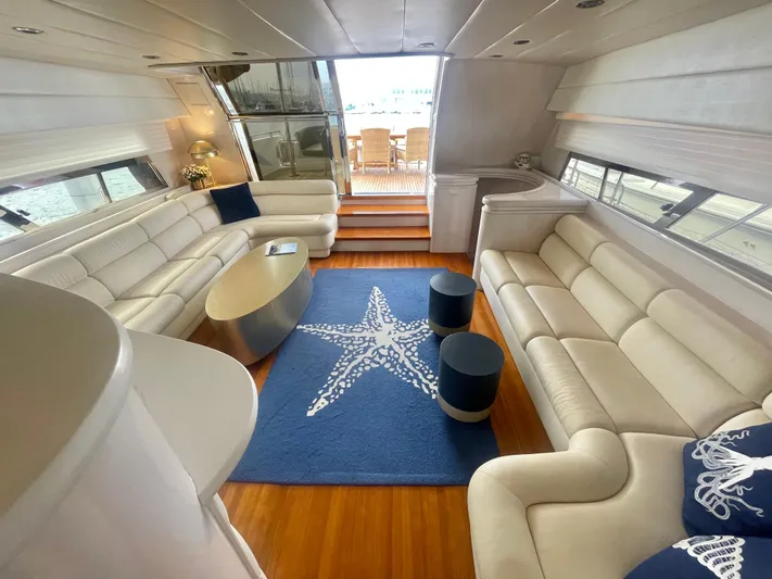 Sand Castle Yacht Photos Pics Luxurious 1996 Johnson 70 Euro yacht interior with white sofas and starfish-themed decor.
