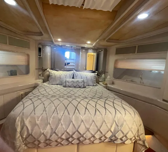 Sand Castle Yacht Photos Pics Luxurious bedroom interior of a 1996 Johnson 70 Euro yacht with elegant bedding.