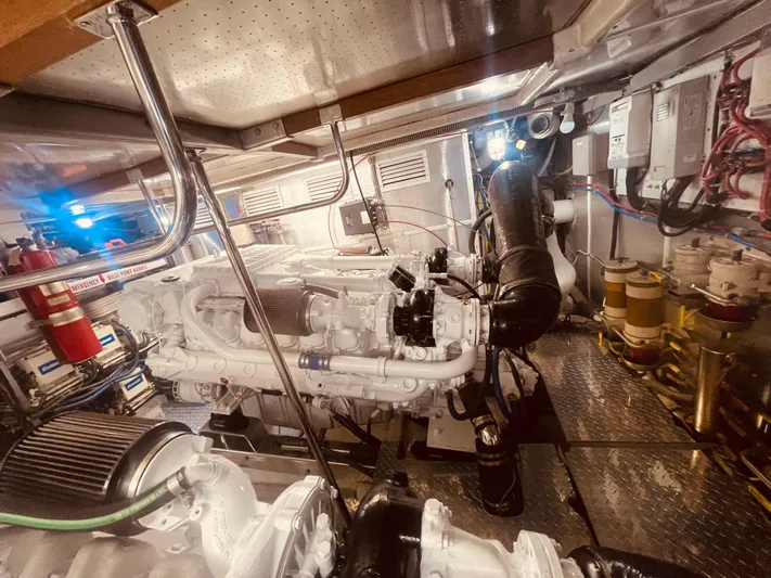 Sand Castle Yacht Photos Pics Engine room of a 1996 Johnson 70 Euro yacht, featuring complex machinery and piping.