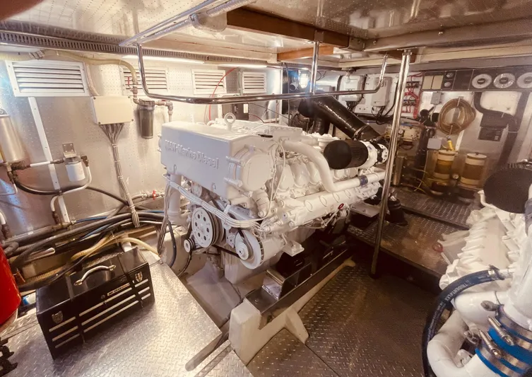 Sand Castle Yacht Photos Pics Engine room of a 1996 Johnson 70 Euro yacht, featuring a well-maintained engine setup.