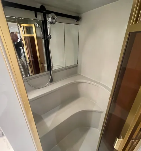 Sand Castle Yacht Photos Pics Luxurious bathroom in 1996 Johnson 70 Euro yacht with modern shower and seating.