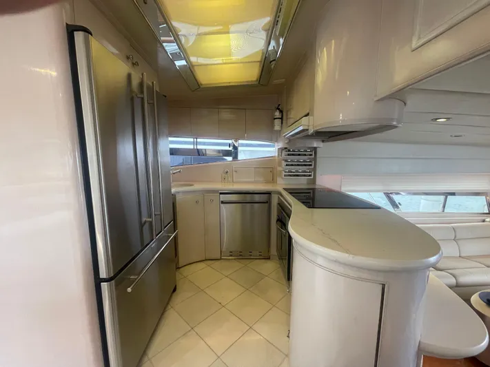 Sand Castle Yacht Photos Pics Luxurious kitchen interior on a 1996 Johnson 70 Euro yacht, featuring modern appliances and sleek design.