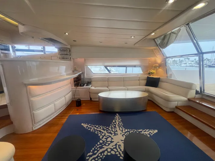 Sand Castle Yacht Photos Pics Luxurious yacht interior with white leather seating, starfish rug, and panoramic windows. Johnson 70 Euro, 1996.