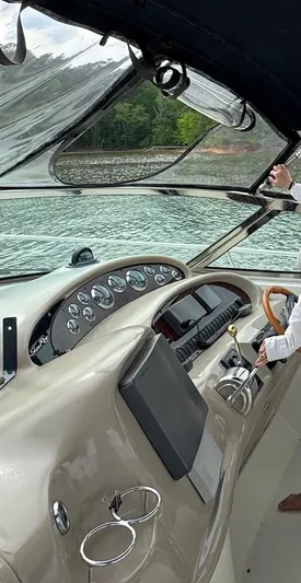  Yacht Photos Pics 2001 Sea Ray 380 Sundancer helm with gauges, steering wheel, and water view.