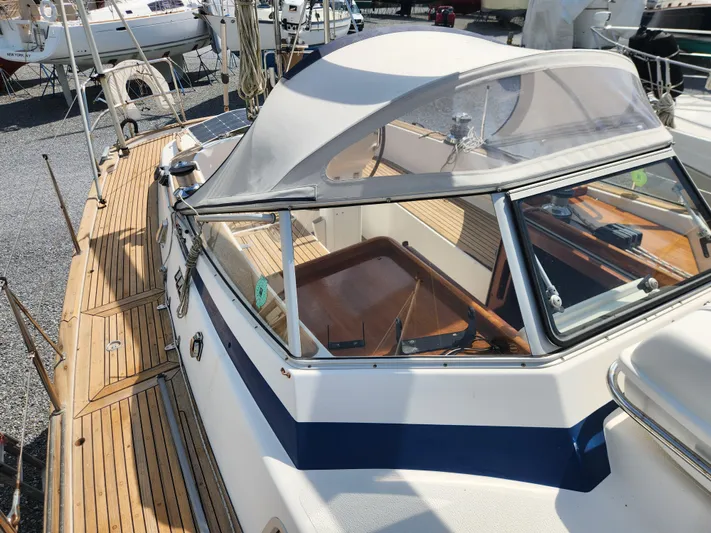 Vivace 1 Yacht Photos Pics 2002 Hallberg-Rassy 36 MKII sailboat with teak deck and cockpit canopy, docked in a marina.