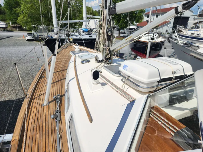 Vivace 1 Yacht Photos Pics 2002 Hallberg-Rassy 36 MKII sailboat with teak deck, docked in a marina.