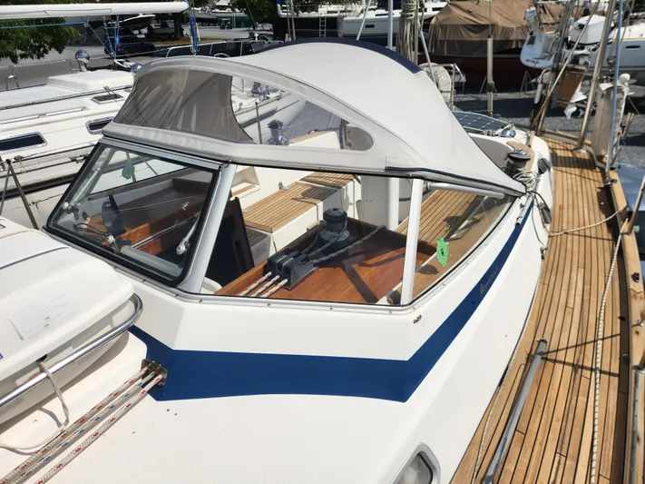 Vivace 1 Yacht Photos Pics 2002 Hallberg-Rassy 36 MKII sailboat with wooden deck and cockpit canopy.