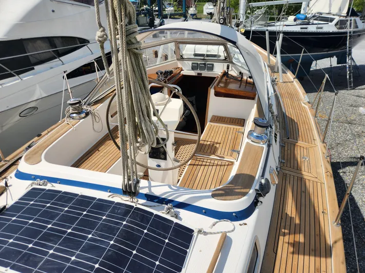Vivace 1 Yacht Photos Pics 2002 Hallberg-Rassy 36 MKII sailboat with teak deck and solar panels in marina.