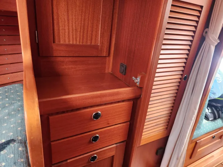 Vivace 1 Yacht Photos Pics Wooden interior of 2002 Hallberg-Rassy 36 MKII yacht with drawers and cabinet.
