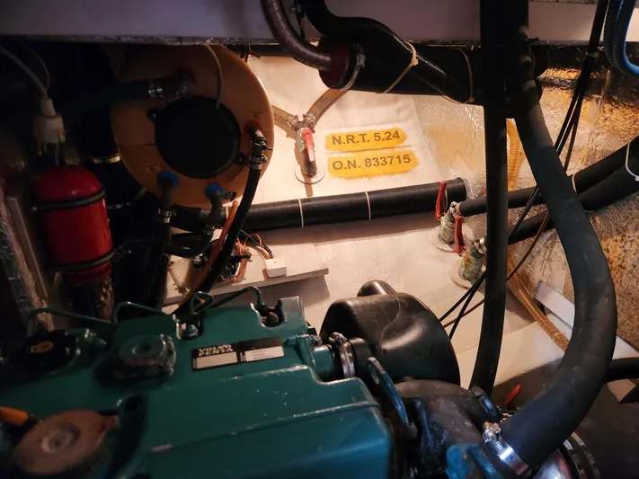 Vivace 1 Yacht Photos Pics Engine room of a 2002 Hallberg-Rassy 36 MKII sailboat, showcasing mechanical components.