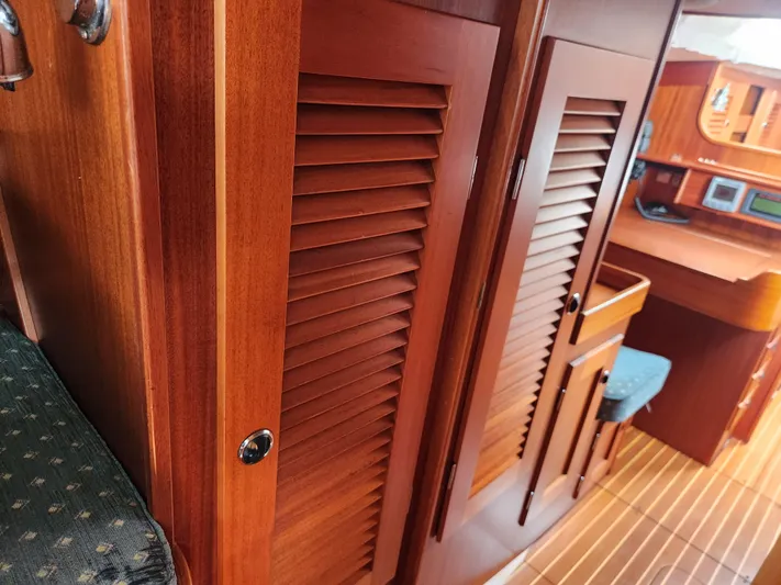 Vivace 1 Yacht Photos Pics Hallberg-Rassy 36 MKII 2002 interior with wooden cabinetry and seating area.