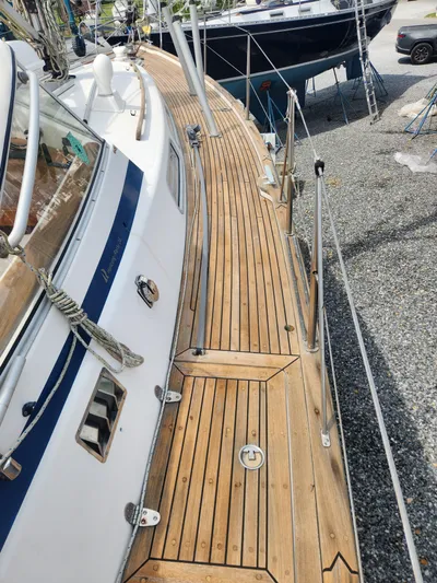 Vivace 1 Yacht Photos Pics 2002 Hallberg-Rassy 36 MKII sailboat with teak deck, docked in a marina.