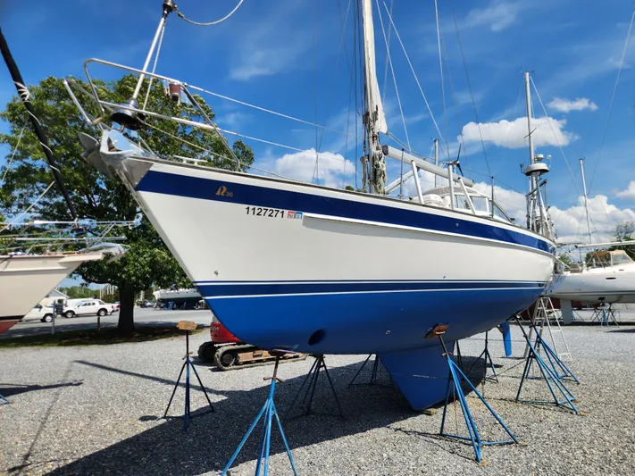 Vivace 1 Yacht Photos Pics 2002 Hallberg-Rassy 36 MKII sailboat on stands, clear sky background.