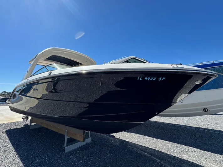  Yacht Photos Pics 2019 Sea Ray SLX 310 boat on display under clear blue sky.