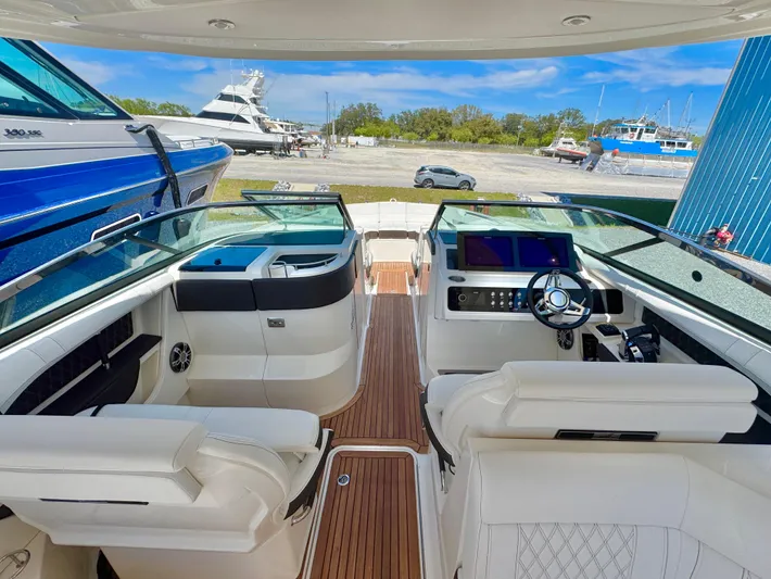  Yacht Photos Pics 2019 Sea Ray SLX 310 boat interior with luxurious seating and modern dashboard.