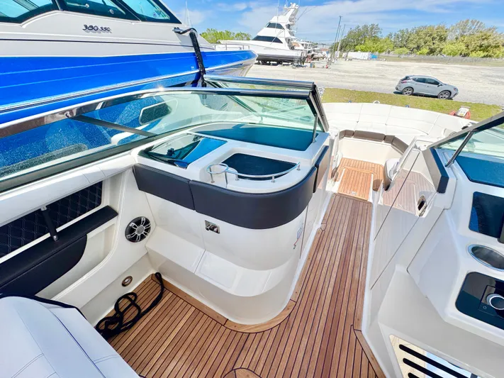  Yacht Photos Pics 2019 Sea Ray SLX 310 boat interior with sleek design and wooden flooring.