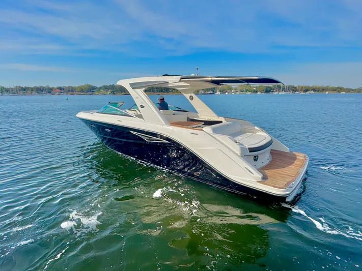  Yacht Photos Pics 2019 Sea Ray SLX 310 boat cruising on a sunny lake.