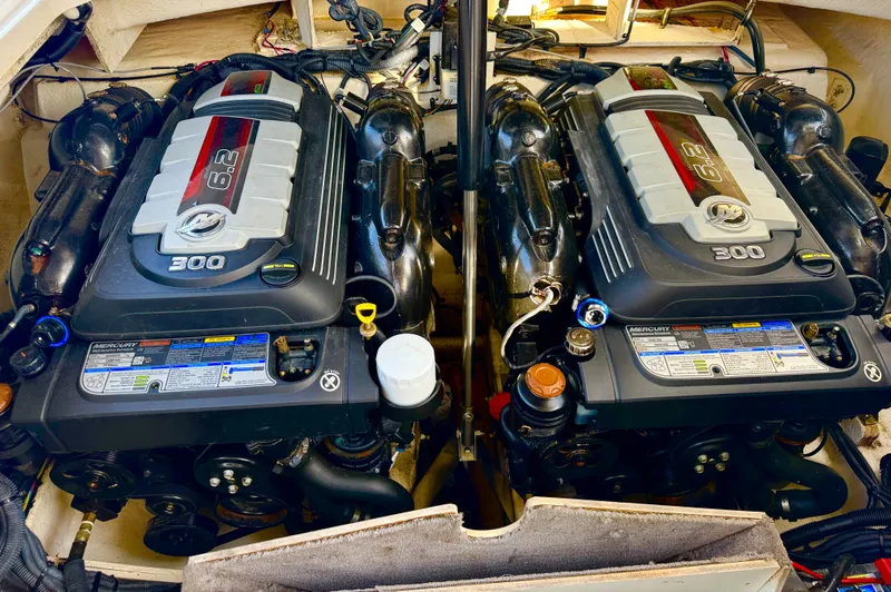  Yacht Photos Pics Twin engines of a 2019 Sea Ray SLX 310 boat, showcasing powerful performance.