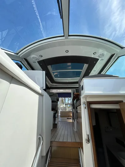 Yacht Photos Pics Interior view of 2014 Cruisers Yachts 41 Cantius with glass ceiling and modern design.