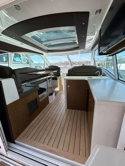  Yacht Photos Pics Interior of 2014 Cruisers Yachts 41 Cantius with modern seating and wood flooring.