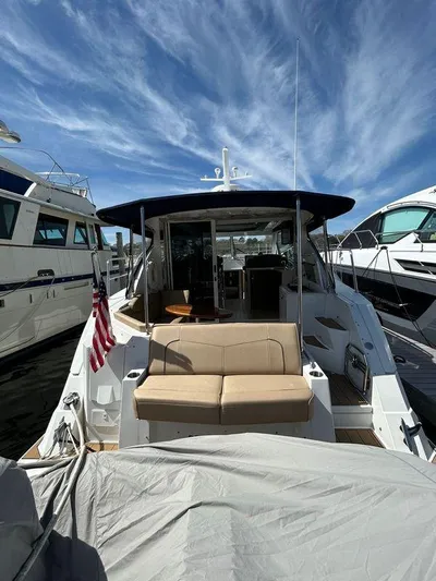  Yacht Photos Pics 2014 Cruisers Yachts 41 Cantius docked, featuring spacious seating and sleek design.