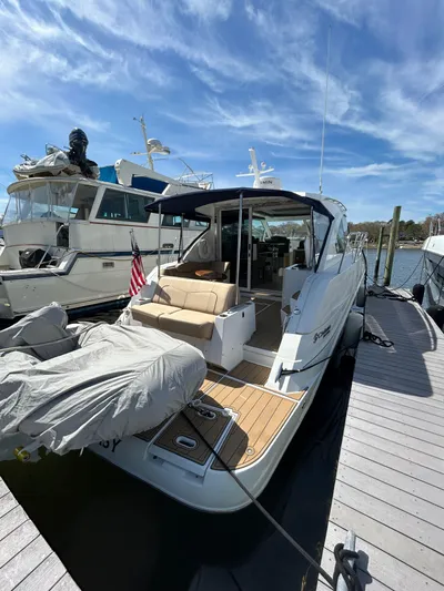  Yacht Photos Pics 2014 Cruisers Yachts 41 Cantius docked, featuring spacious deck and modern design.