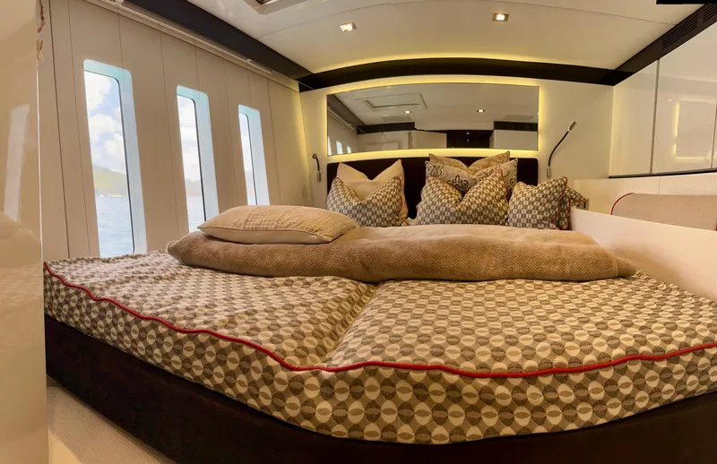  Yacht Photos Pics Luxurious Sunreef 62 yacht bedroom interior, 2018 model, with elegant bedding and modern design.