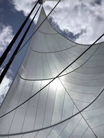  Yacht Photos Pics Sail of 2018 Sunreef 62 yacht against a cloudy sky.