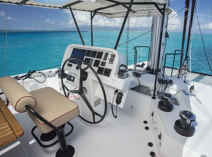  Yacht Photos Pics Helm of 2018 Sunreef 62 yacht with ocean view and modern controls.