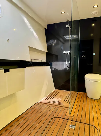  Yacht Photos Pics Luxurious bathroom in 2018 Sunreef 62 yacht with modern shower and wooden flooring.