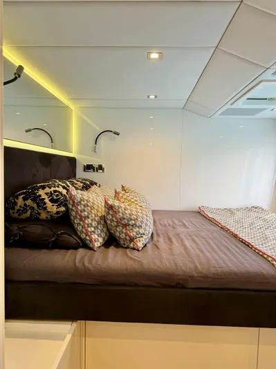  Yacht Photos Pics Luxurious Sunreef 62 yacht bedroom, 2018 model, with modern lighting and plush bedding.