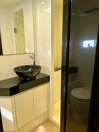  Yacht Photos Pics Modern bathroom on 2018 Sunreef 62 yacht with sleek black sink and compact design.