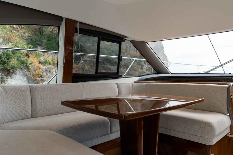  Yacht Photos Pics Luxurious interior of 2024 Princess F45 yacht with elegant seating and table.