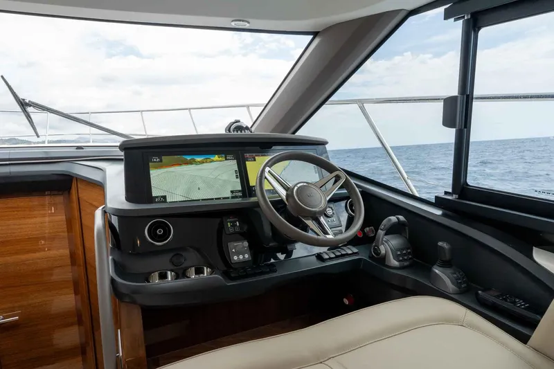  Yacht Photos Pics 2024 Princess F45 yacht helm with modern navigation system and ocean view.