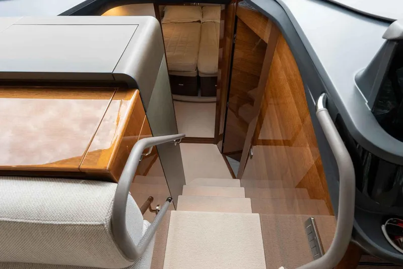  Yacht Photos Pics Luxurious interior of 2024 Princess F45 yacht, featuring elegant wooden stairs and modern design.