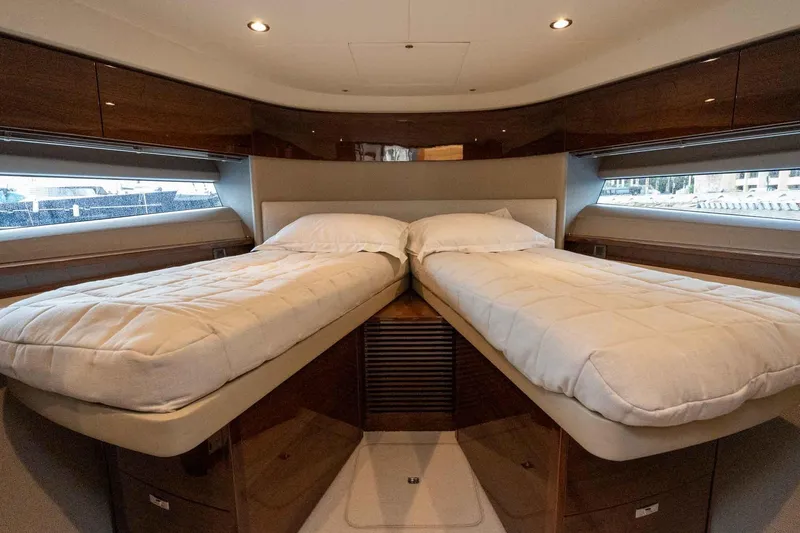  Yacht Photos Pics Luxurious twin cabin interior of 2024 Princess F45 yacht with elegant wood finishes.