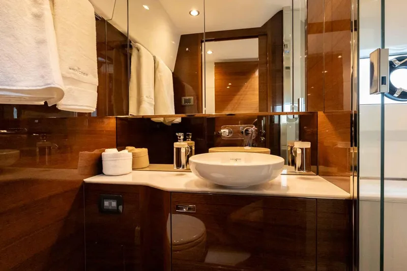  Yacht Photos Pics Luxurious bathroom in 2024 Princess F45 yacht with modern fixtures and elegant design.