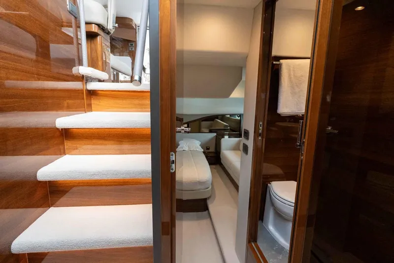  Yacht Photos Pics Luxurious interior of 2024 Princess F45 yacht featuring stairs, bedroom, and bathroom.