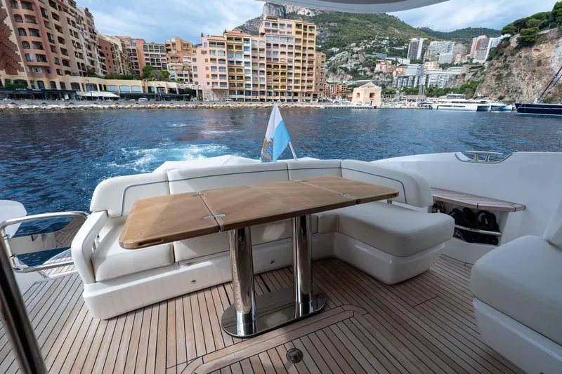  Yacht Photos Pics Luxurious 2024 Princess F45 yacht deck with scenic waterfront view.