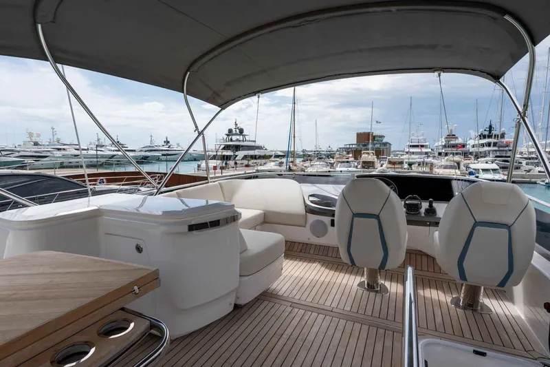  Yacht Photos Pics Luxurious 2024 Princess F45 yacht interior with elegant seating and marina view.