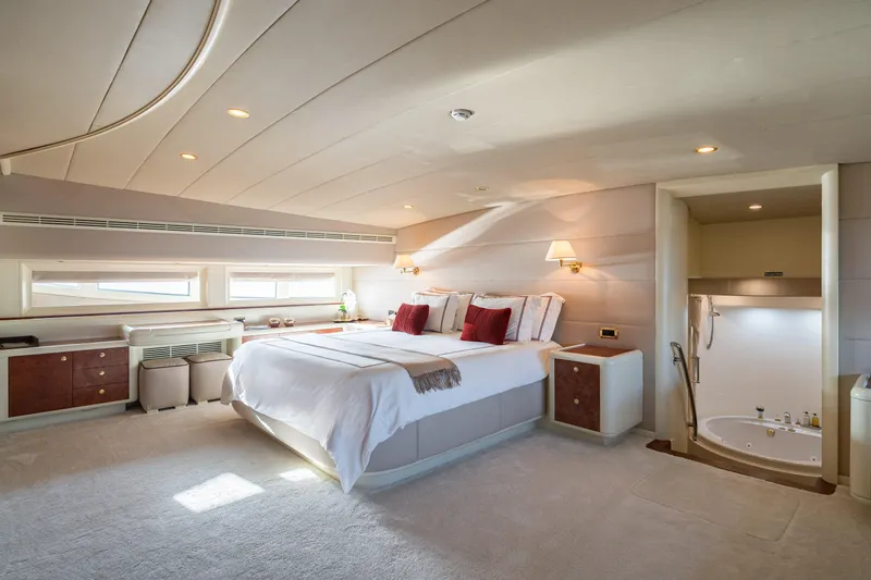 Viking III Yacht Photos Pics Luxurious bedroom interior on 2004 Notika CENTURION 115 yacht with elegant decor and ensuite bathroom.