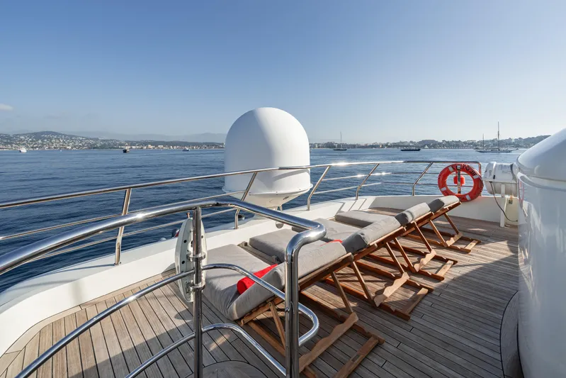 Viking III Yacht Photos Pics Deck of 2004 Notika CENTURION 115 yacht with sun loungers and ocean view.