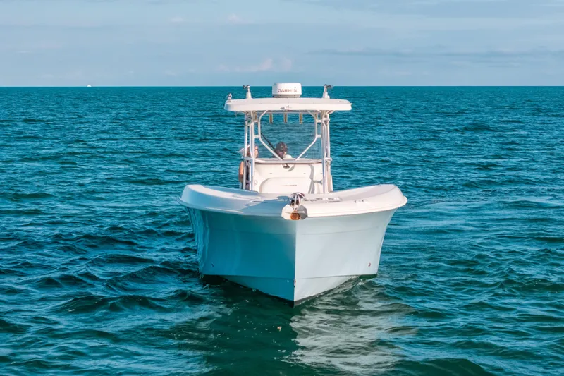  Yacht Photos Pics 2005 Hydra-Sports 3300 CC boat cruising on open ocean waters.