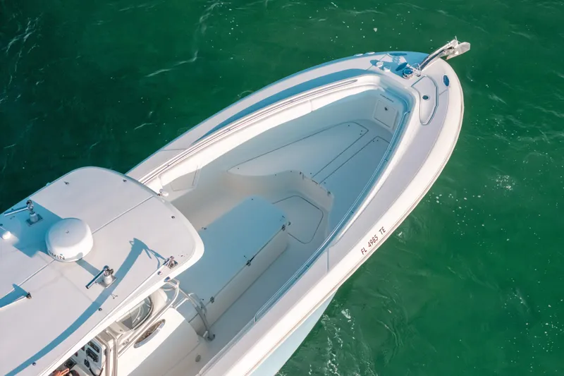  Yacht Photos Pics 2005 Hydra-Sports 3300 CC boat on clear green water, aerial view.