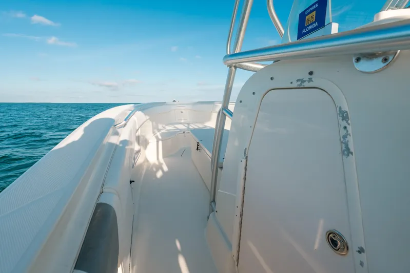  Yacht Photos Pics 2005 Hydra-Sports 3300 CC boat deck with ocean view, clear blue sky.