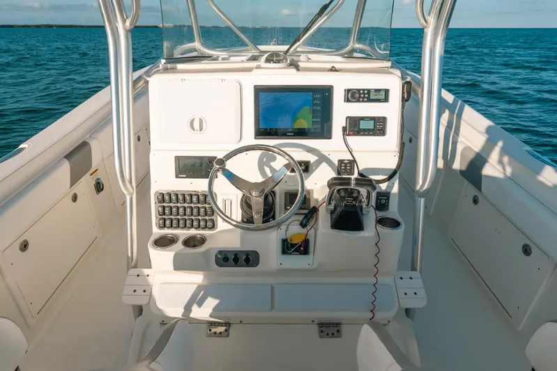  Yacht Photos Pics 2005 Hydra-Sports 3300 CC boat dashboard with navigation equipment on open water.
