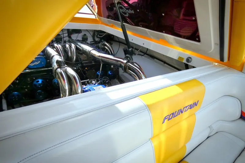  Yacht Photos Pics 2006 Fountain 47 Lightning boat engine with yellow and white interior detailing.