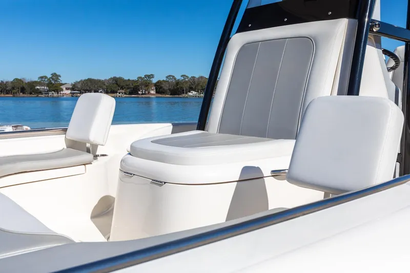  Yacht Photos Pics 2023 ShearWater 260 SS Carolina boat interior with comfortable seating on a sunny day.