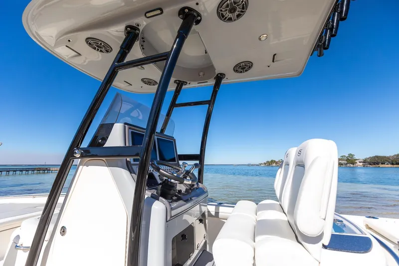  Yacht Photos Pics 2023 ShearWater 260 SS Carolina boat interior with helm and seating, ocean view.