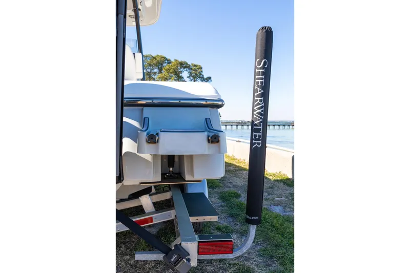  Yacht Photos Pics 2023 ShearWater 260 SS Carolina boat rear view with branded pole cover.